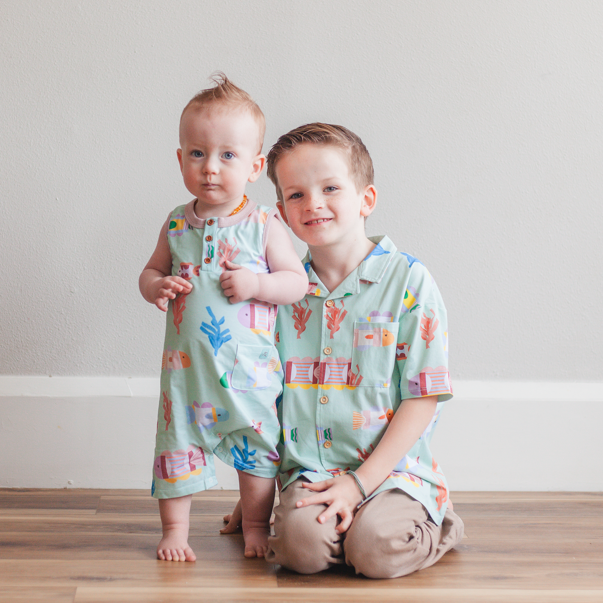 Anise & Ava's Cory button down shirt, designed and made in one of a kind, exclusive hand drawn gender neutral colorful art. Created to match with other siblings' styles.
