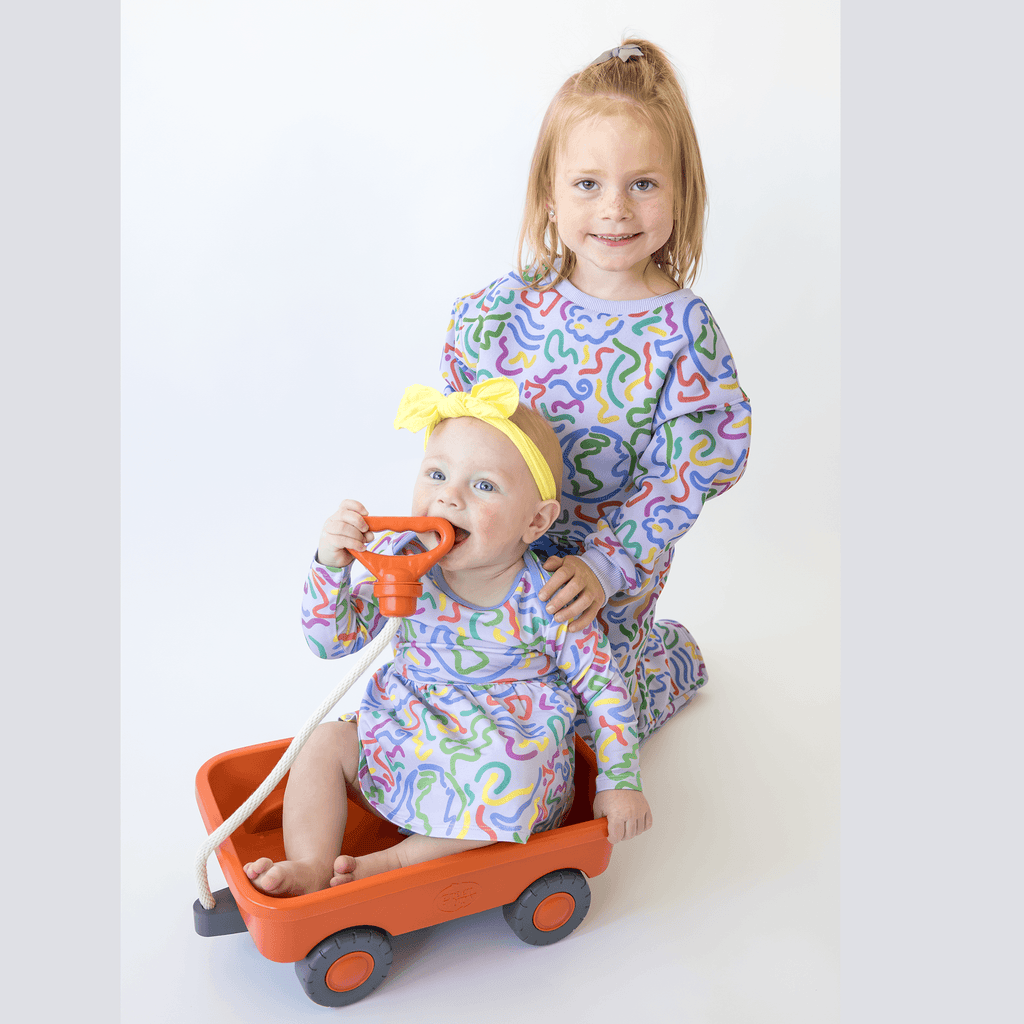 Anise & Ava's gender neutral exclusive hand drawn artwork eco friendly printed on a all cotton fleece. Made to match baby sibling's onesie. Perfect cozy pullover for the winter with a burst of color and inspiring art. 