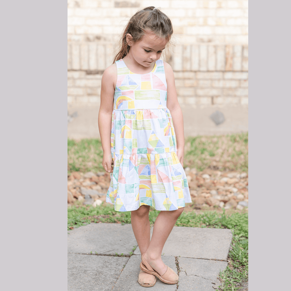 Anise & Ava genderless hand drawn exclusive art, eco friendly printed on luxury cotton. Anise & Ava sleeveless racer back dress, designed and made to match siblings' styles of baby onesies, dresses, tees, and shorts.