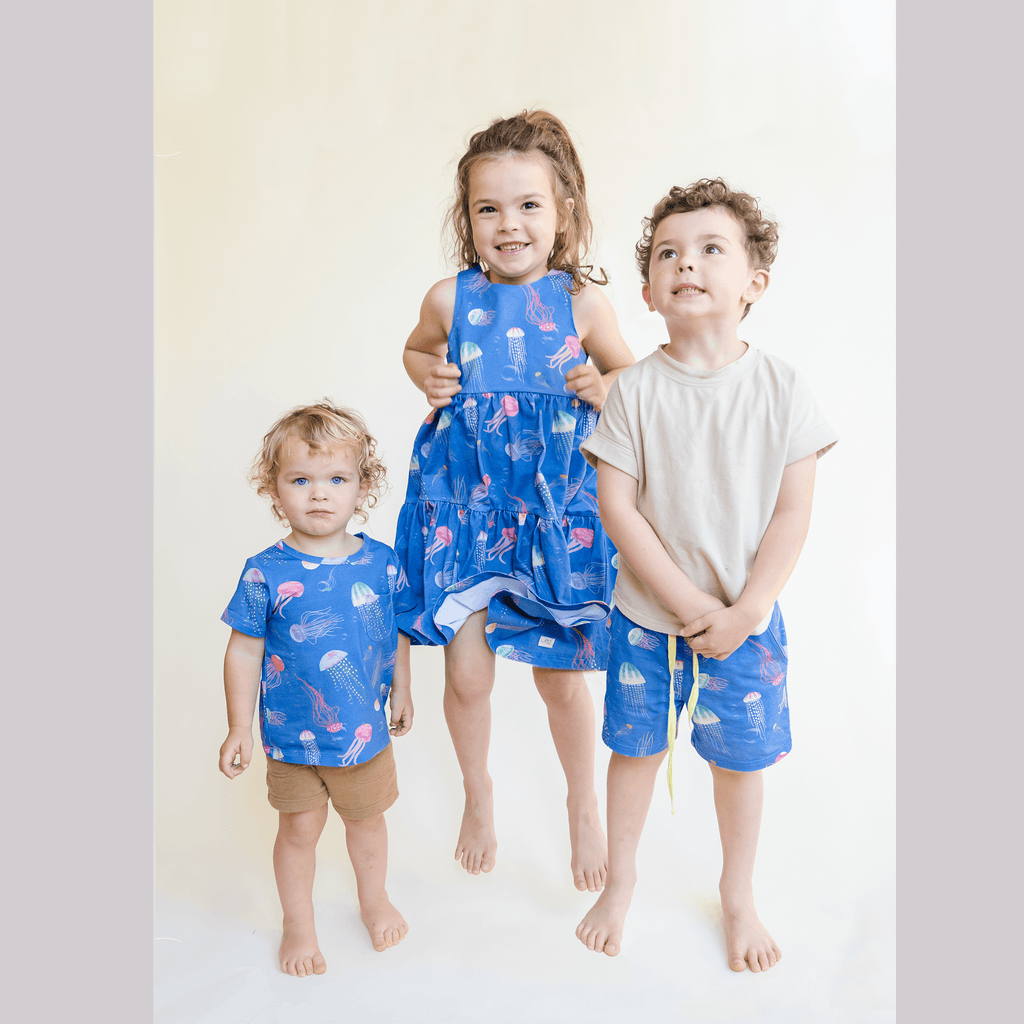 Anise & Ava genderless hand drawn exclusive art, eco friendly printed on luxury cotton. Printed jellysfish shorts are made with inseam fit for both boys & girls to tumble all day long. Can wear it alone or as a set. Made to match all siblings, baby onesie, romper, dresses and shorts. 