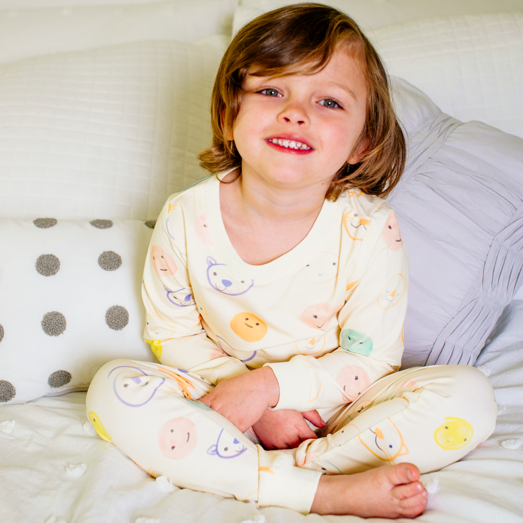 Anise & Ava genderless kids' pajamas in printed luxury cotton in Smiley. Made to match and twin with all siblings. 