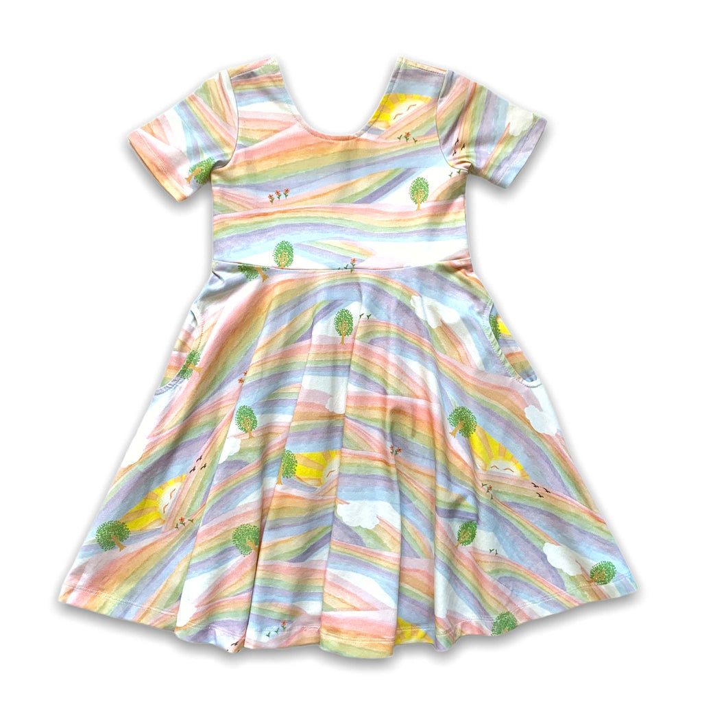 Anise & Ava genderless printed luxury cotton twirl dress with pockets FRONT in print Sunray Rainbow. Made to twin and match with other siblings. 