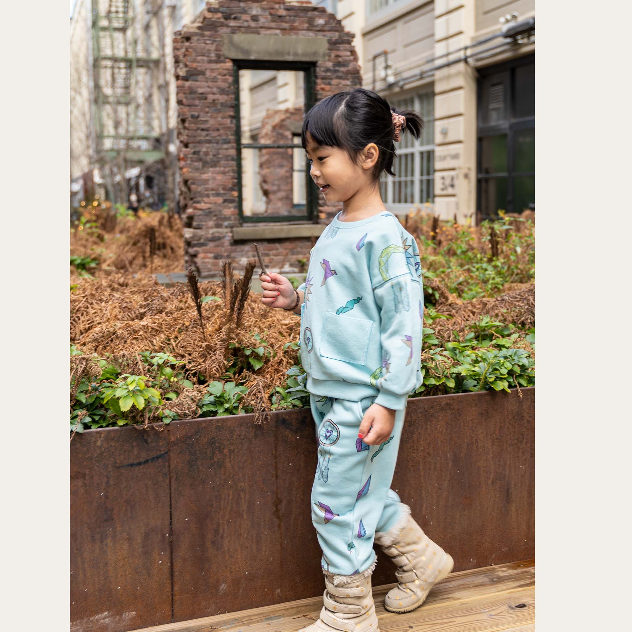 Anise & Ava gender neutral hand drawn art "Charmed" eco friendly printed onto cotton terry kids' long sleeves top with pockets. Made with love and made to match siblings. Top with pockets has a matching pant also made with 2 pockets for all the treasures found along adventures and can wear as a set.