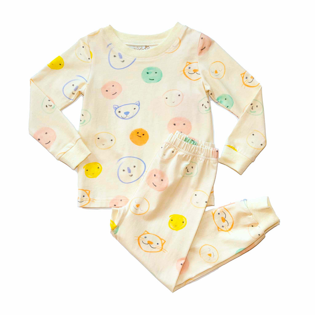 Anise & Ava genderless kids' pajamas set in printed luxury cotton in Smiley. Made to match and twin with all siblings. 