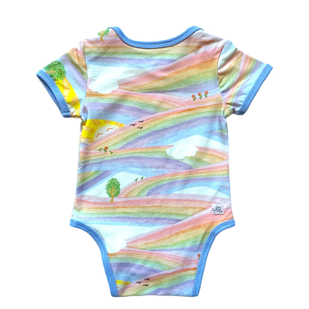 Anise & Ava genderless baby onesie body back in Sunray Rainbow with contrast ribbing and envelop neck for easy wearing. 