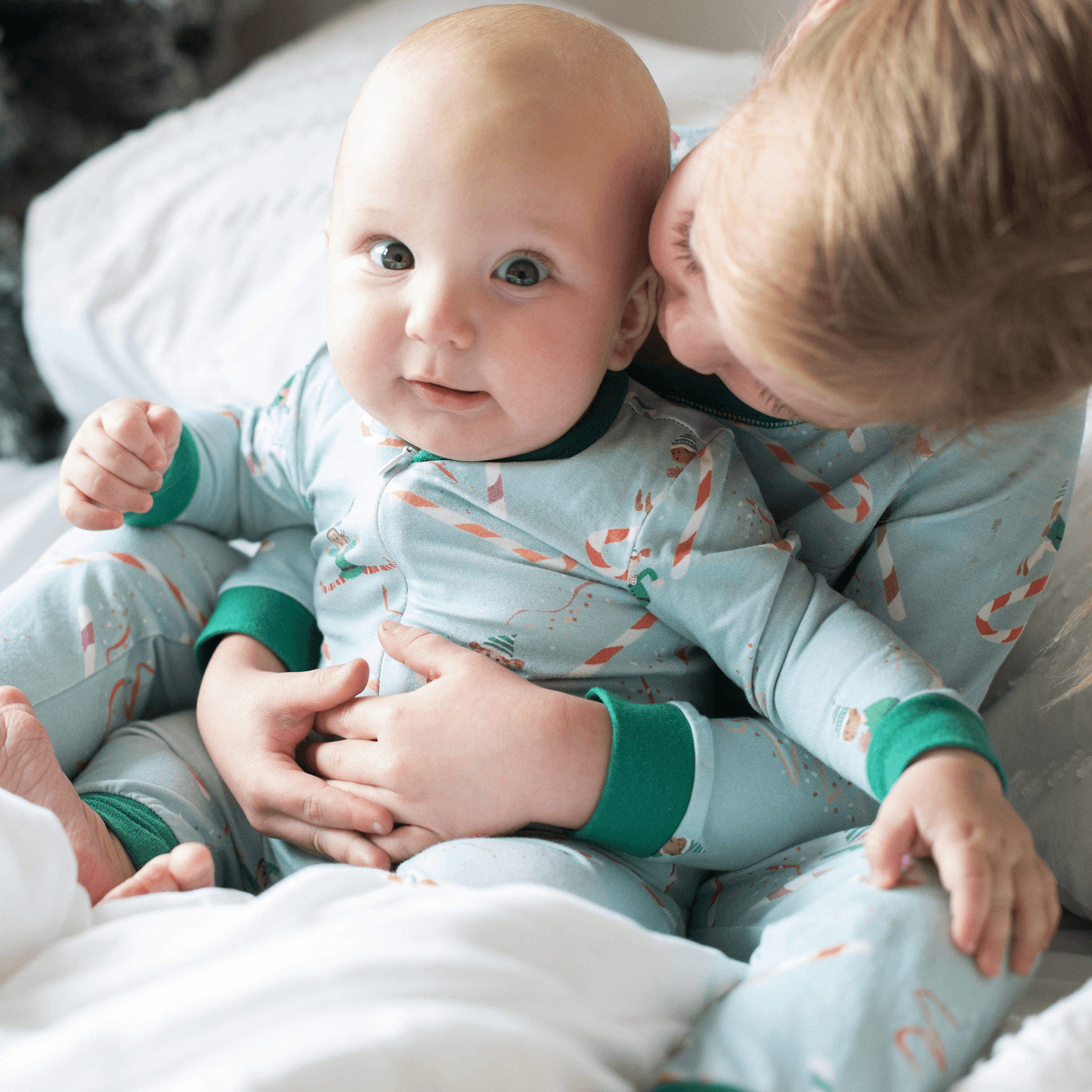 Anise & Ava Holiday baby pajamas in an exclusive hand drawn original art. Genderless print for all baby boys & girls, eco friendly printed, to match siblings' 2 pieces pajamas.