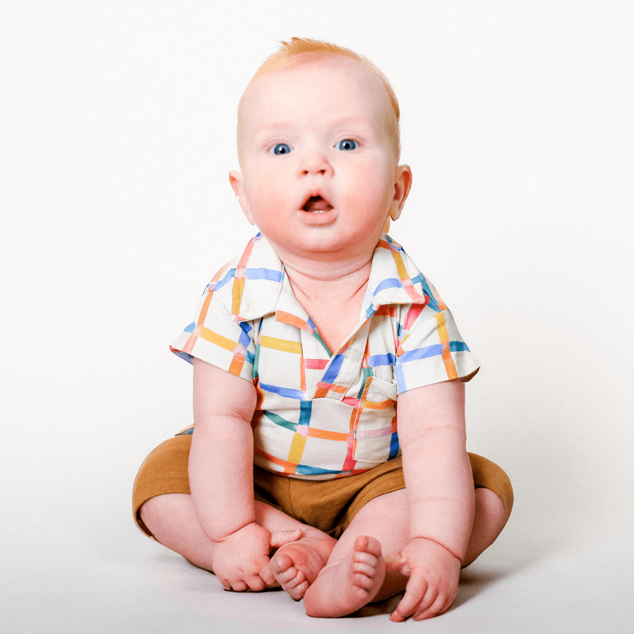 Anise & Ava exclusive hand drawn Grids print, eco friendly printed on luxury stretch cotton into our new point collar polo shirt. Designed and made to match siblings styles. Dress your family in this fun Summer exclusive print made for all boys & girls.