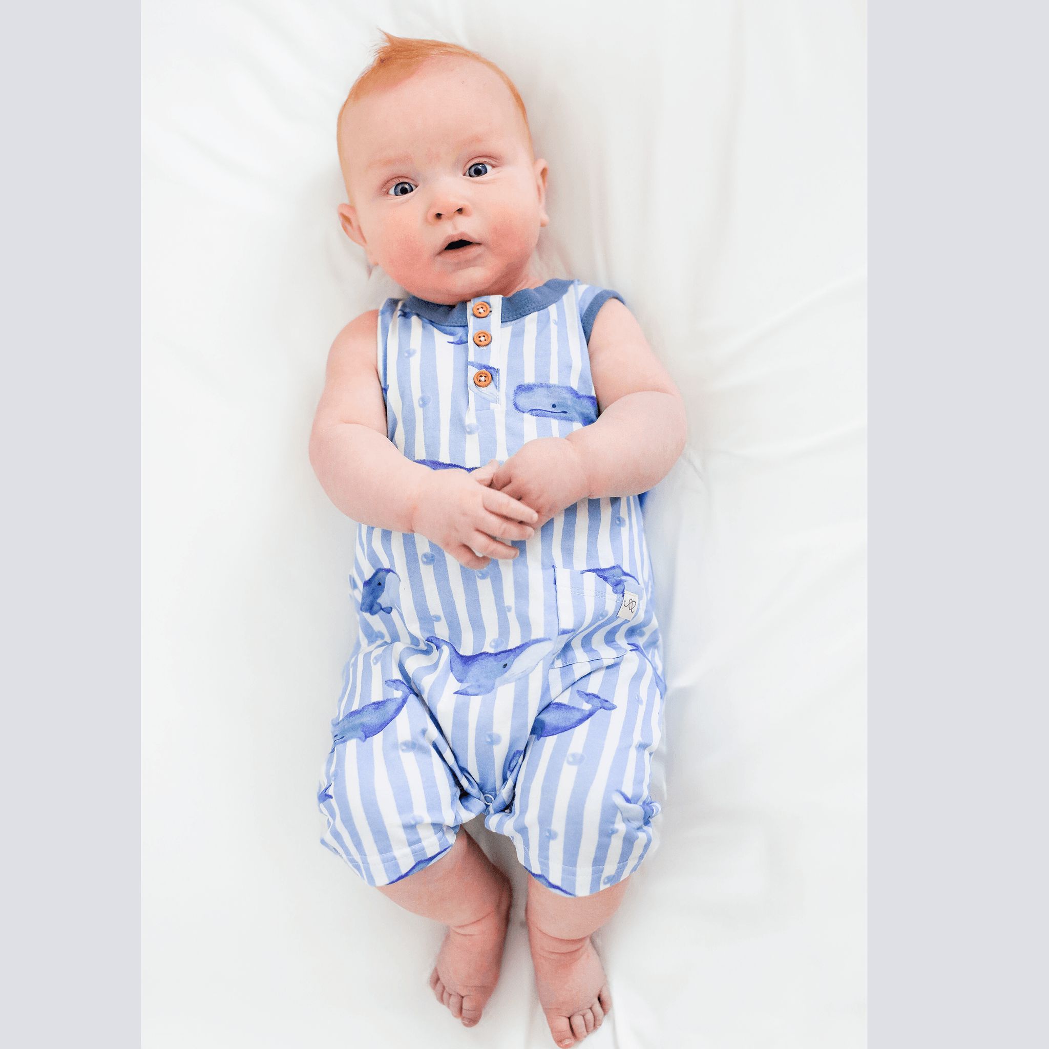 Anise & Ava exclusive hand drawn artwork eco friendly printed onto luxuy stretch cotton. Our one of a kind whales printed baby shorts romper is made to match sibling's polo shirts. 