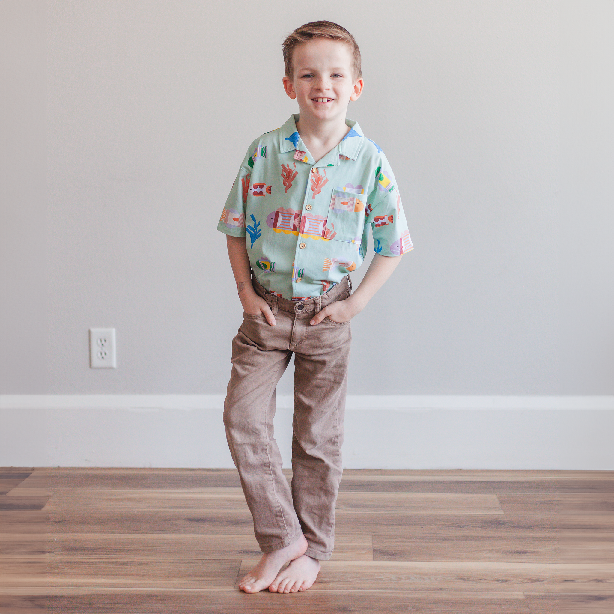 Anise & Ava's Cory button down shirt, designed and made in one of a kind, exclusive hand drawn gender neutral colorful art. Created to match with other siblings' styles. 