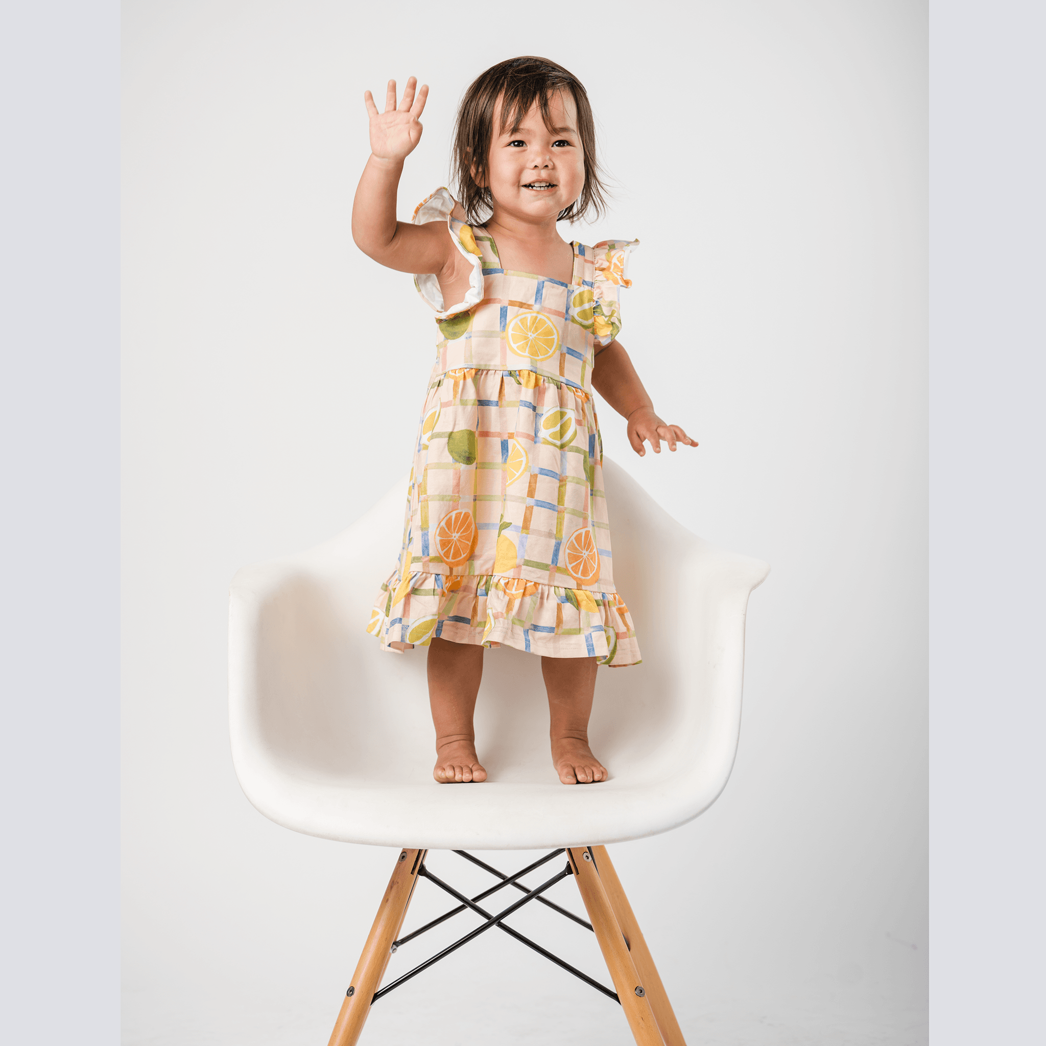 Anise & Ava exclusive hand drawn genderless Citrus print eco friendly printed on luxury stretch cotton. Designed and made to match siblings styles. Our new sleeveless Summer dress with ruffles is made to match siblings styles in baby & kids Brooklyn pocket tee for both boys and girls. 