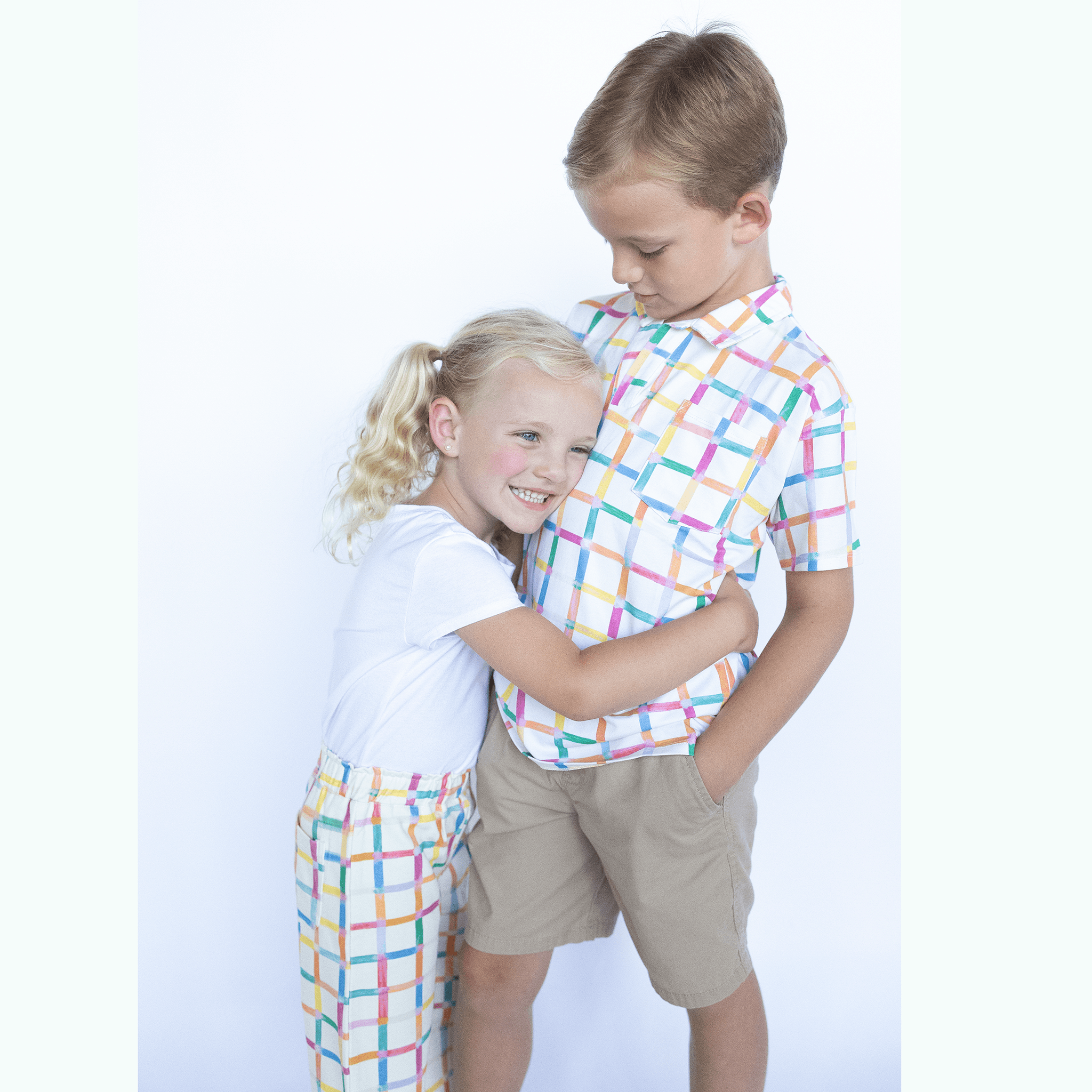 Anise & Ava exclusive hand drawn Grids print, eco friendly printed on luxury stretch cotton into our new point collar polo shirt. Designed and made to match siblings styles. Dress your family in this fun Summer exclusive print made for all boys & girls.