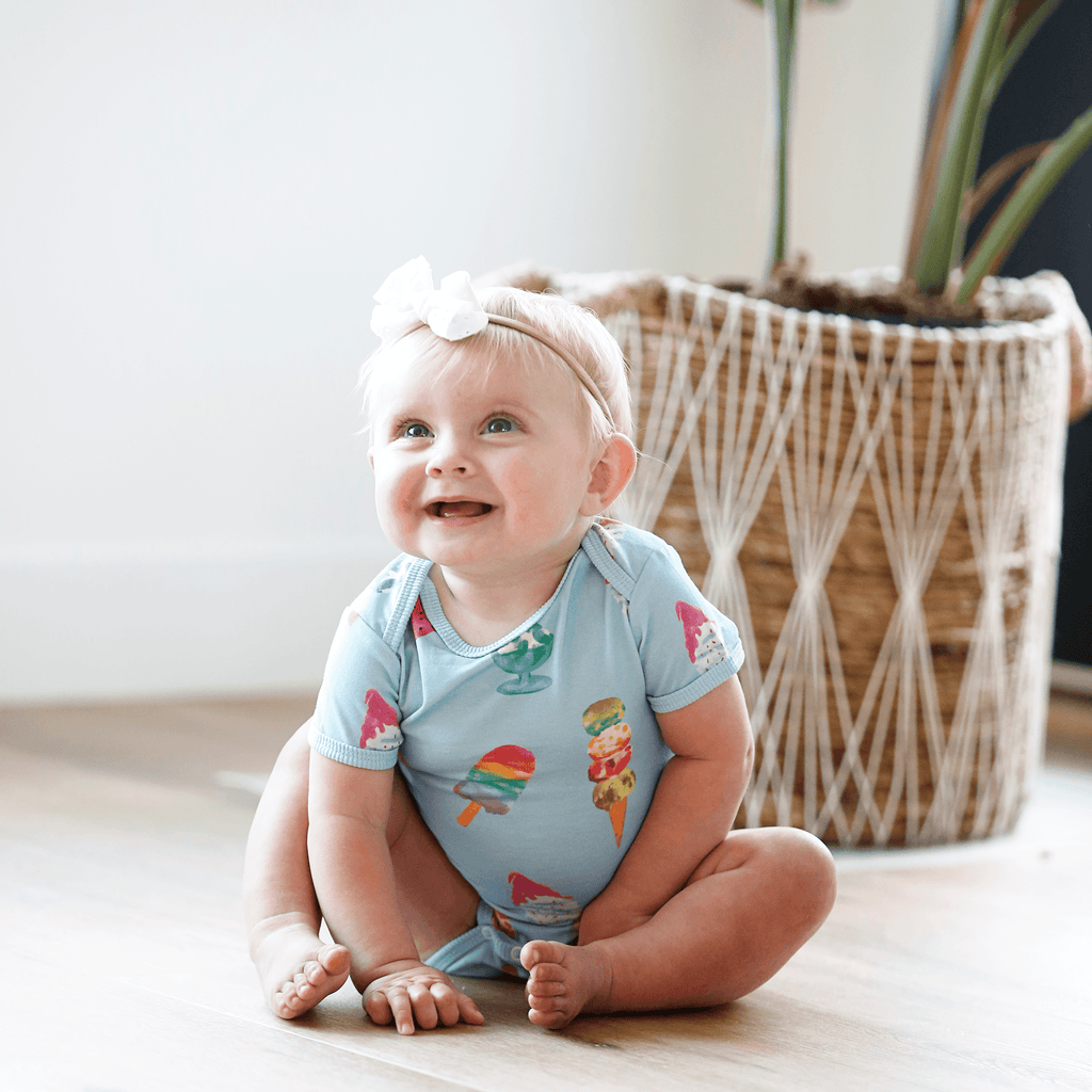 Anise & Ava genderless baby snap body in Sundaes print, designed and hand drawn inhouse. Sundaes is an exclusive print eco friendly printed on the softest cotton. Made to match siblings' styles in kids. 