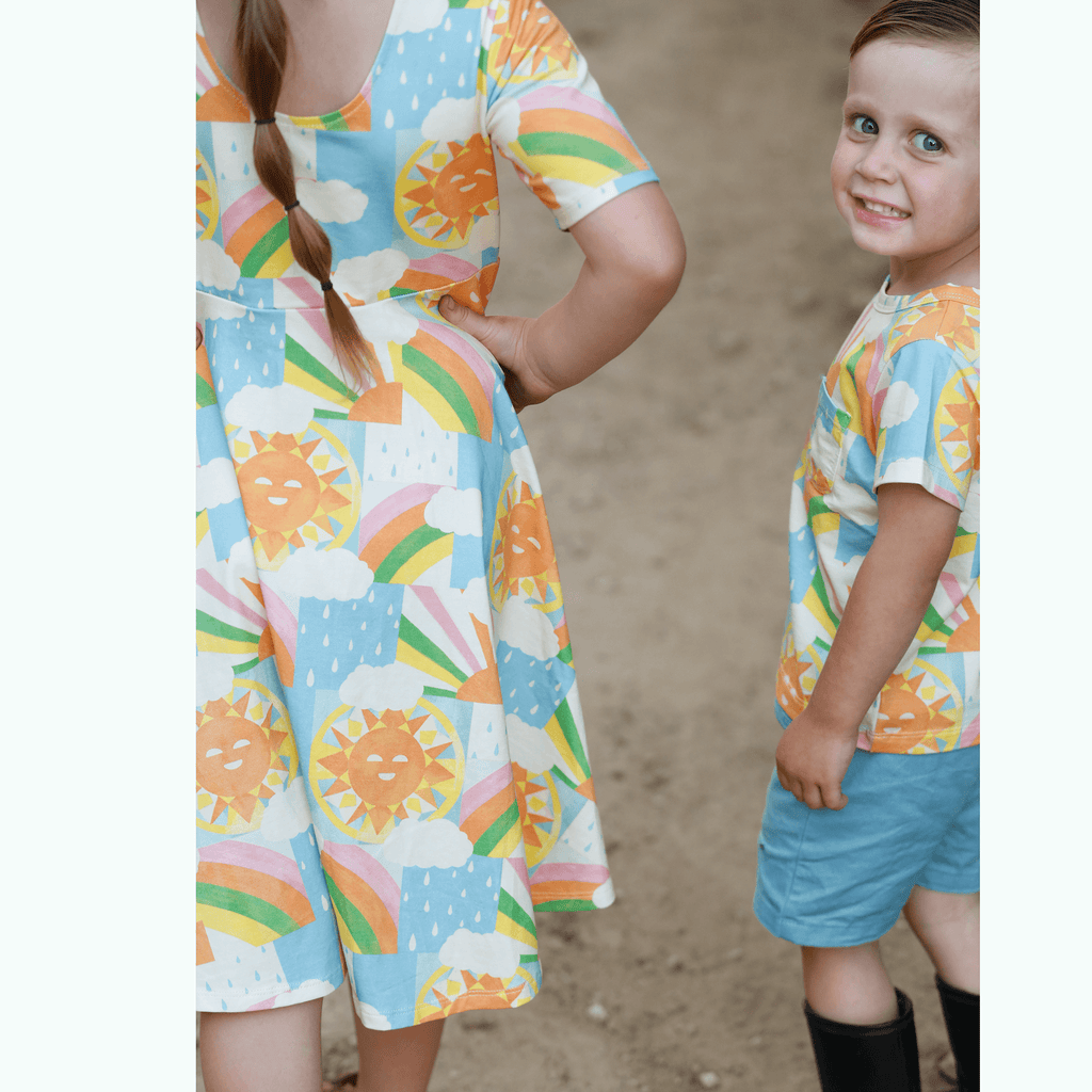 Anise & Ava exclusive hand drawn Sun print eco friendly printed on luxury stretch cotton. Designed and made to match siblings styles. Short sleeves Journey dress is Anise & Ava best selling style, made with deep pockets to hold all the treasures. Siblings matching styles are Brooklyn tee & Charlie baby dress. 