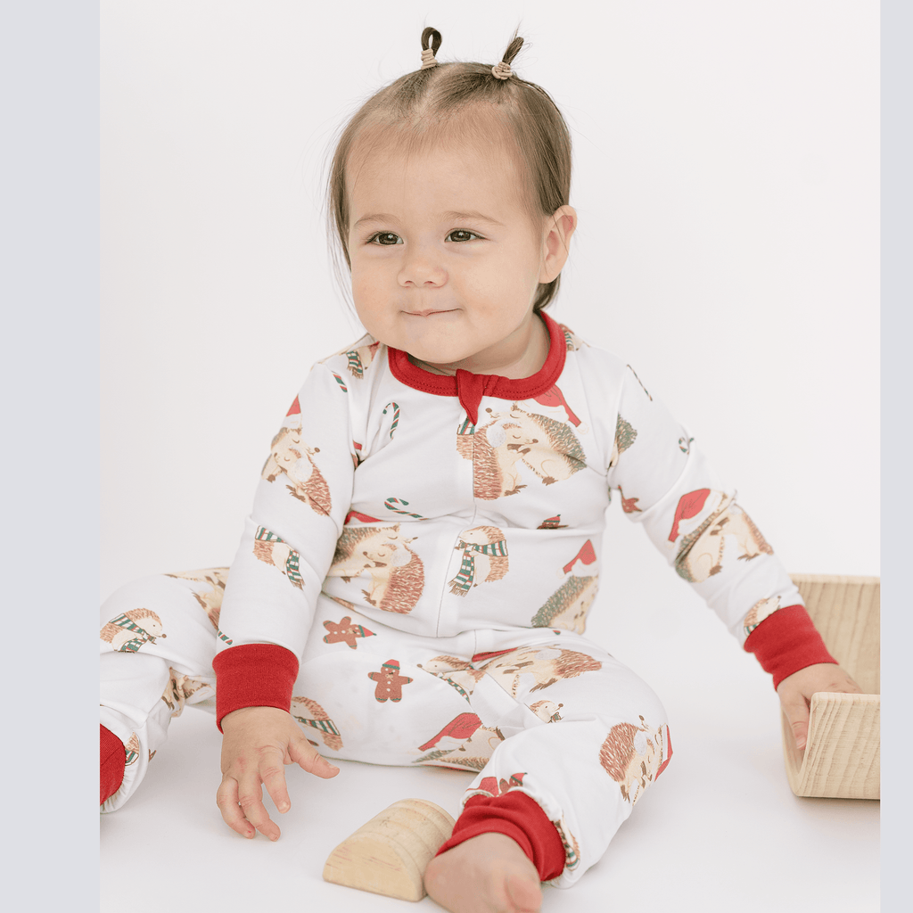 Anise & Ava's gender neutral exclusive hand drawn art in hedgehogs with Holiday hats,, eco friendly printed onto the softest cotton. Made to match siblings' 2 pieces pajamas sets. 