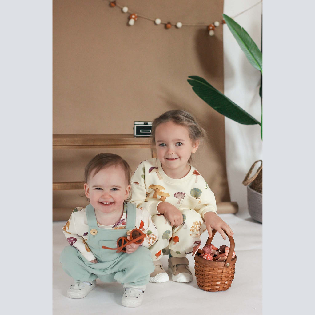 Anise & Ava genderless exclusive hand drawn mushrooms print, eco friendly printed on fabric. Made in a long sleeves most loved sweatshirt with dye to match ribbs pockets for babies to kids, boys & girls. 