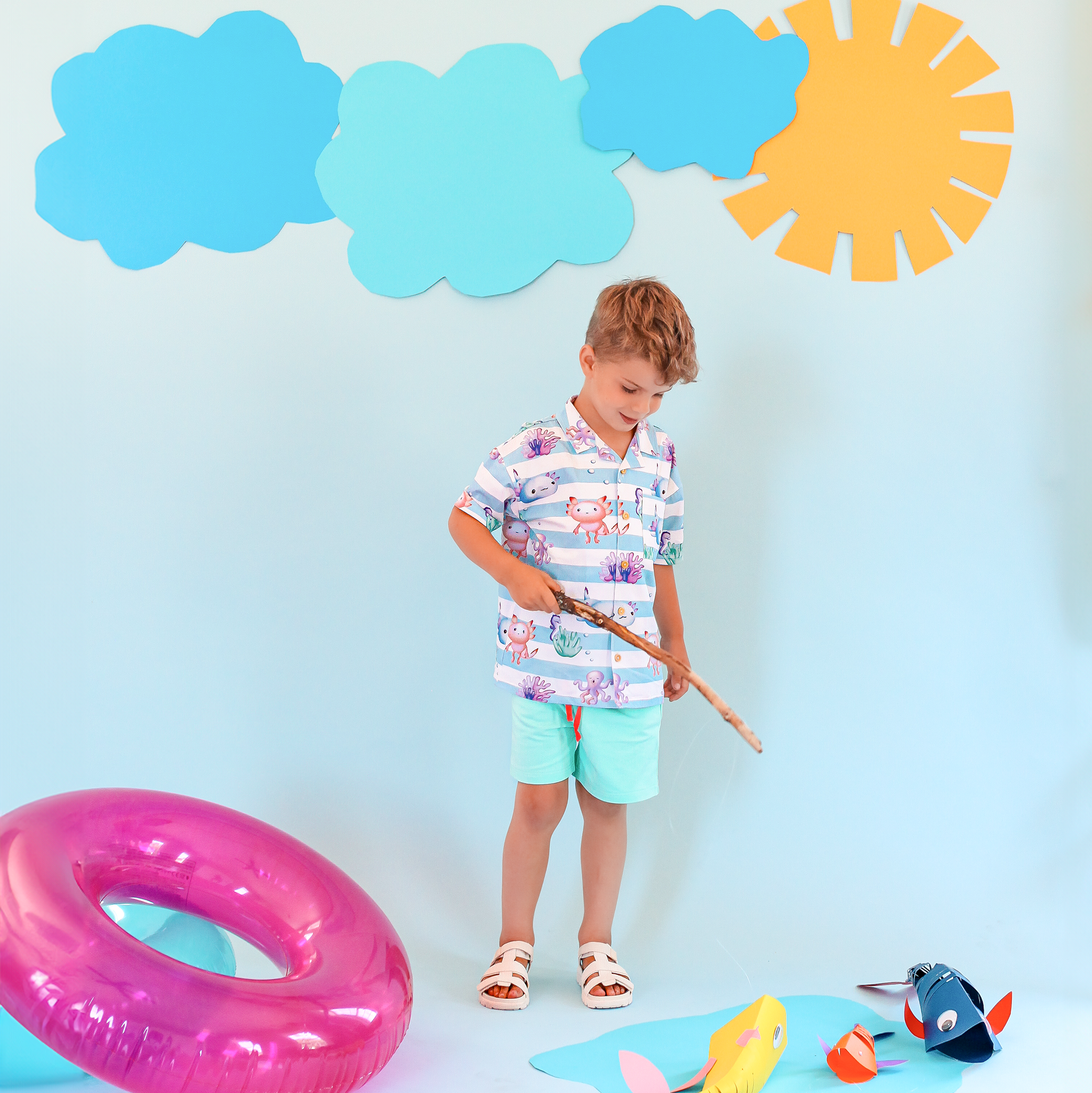 Anise & Ava's Cory button down shirt, designed and made in one of a kind, exclusive hand drawn gender neutral colorful art, featuring a special axolyt. Created to match with other siblings' styles. 