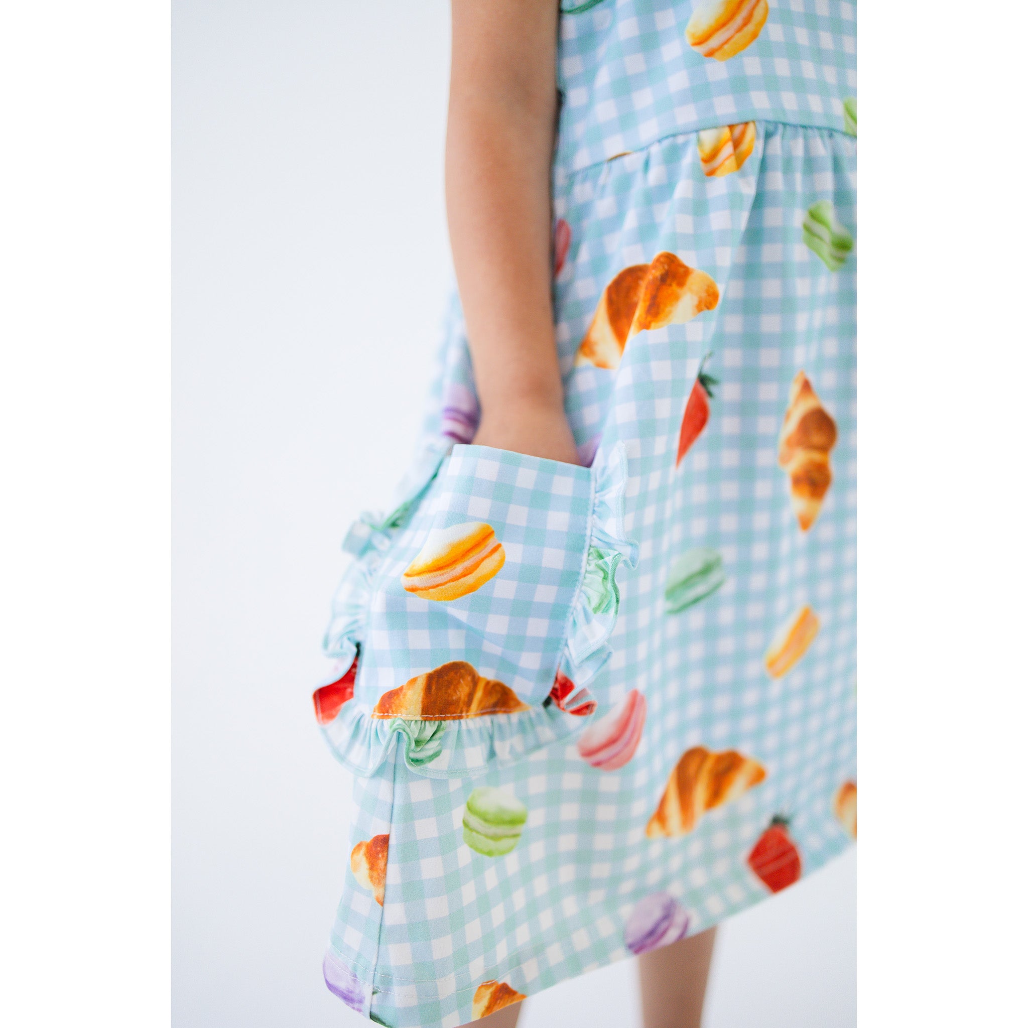 Anise & Ava's Ashley dress with rufles, best seller updated with ruffled pockets, in Picnic Time print, designed and made to match siblings' styles. 