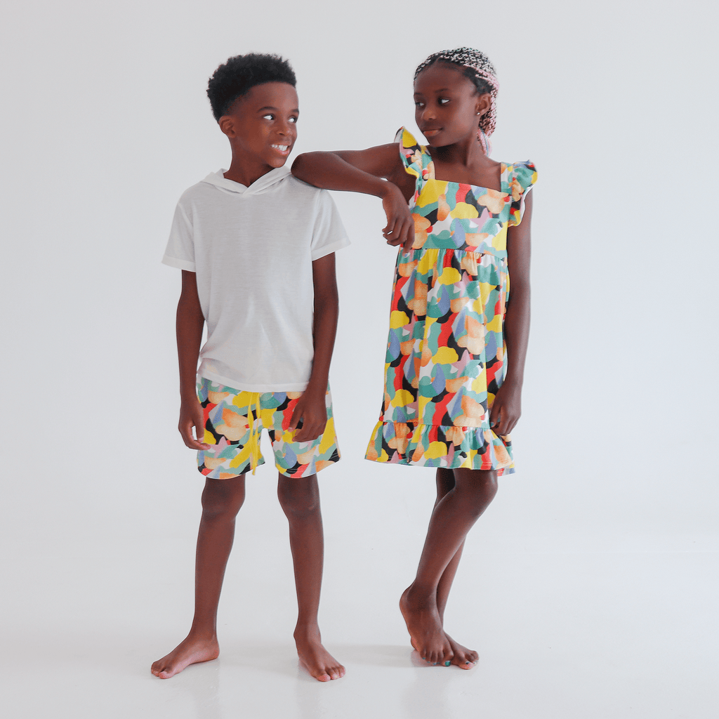 Anise & Ava exclusive hand drawn genderless Citrus print eco friendly printed on luxury stretch cotton. Designed and made to match siblings styles. Our new sleeveless Summer dress with ruffles is made to match siblings styles in baby & kids Brooklyn pocket tee for both boys and girls. 