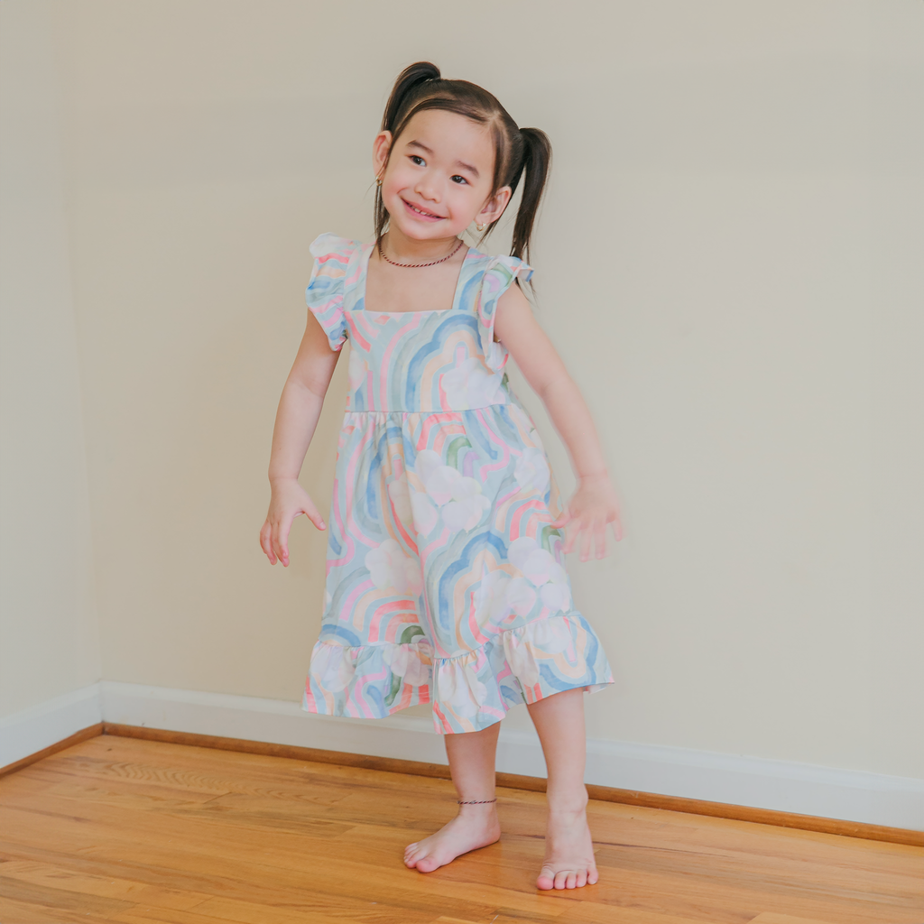 Anise & Ava's ruffled summer dress, designed and made in an exclusive hand drawn print to match baby siblings' styles. 