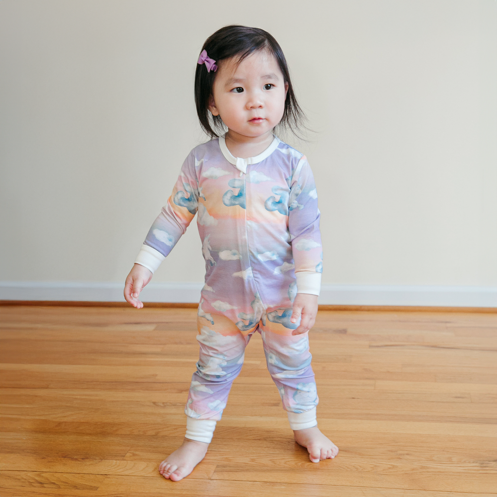 Anise & Ava long sleeves baby zippy onesie. Designed and made with exclusive hand drawn matching ombre dreamy prints to match kids' pajamas. 