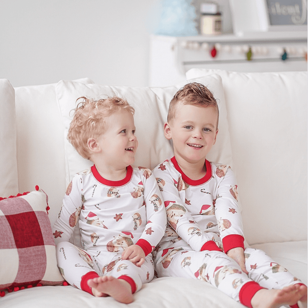 Anise & Ava gender neutral exclsive hand drawn Holiday Hedgehogs, eco friendly printed onto our softest cotton. Made to match siblings' baby pajamas.  