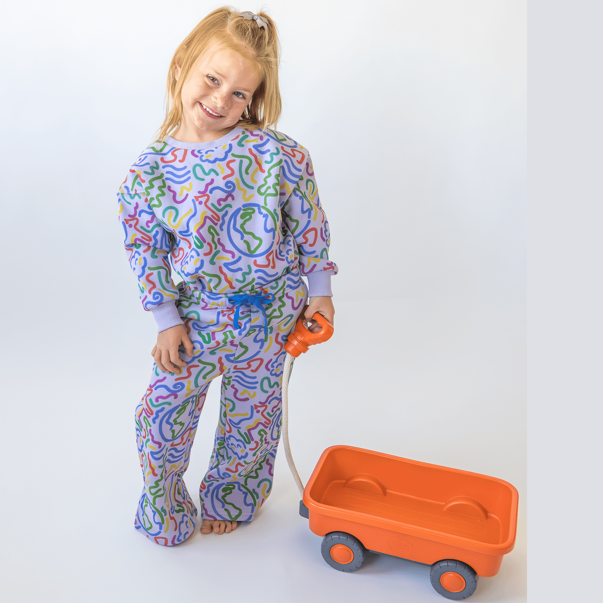 Anise & Ava's gender neutral exclusive hand drawn artwork eco friendly printed on a all cotton fleece. Made to match baby sibling's onesie. Perfect cozy pullover for the winter with a burst of color and inspiring art. 