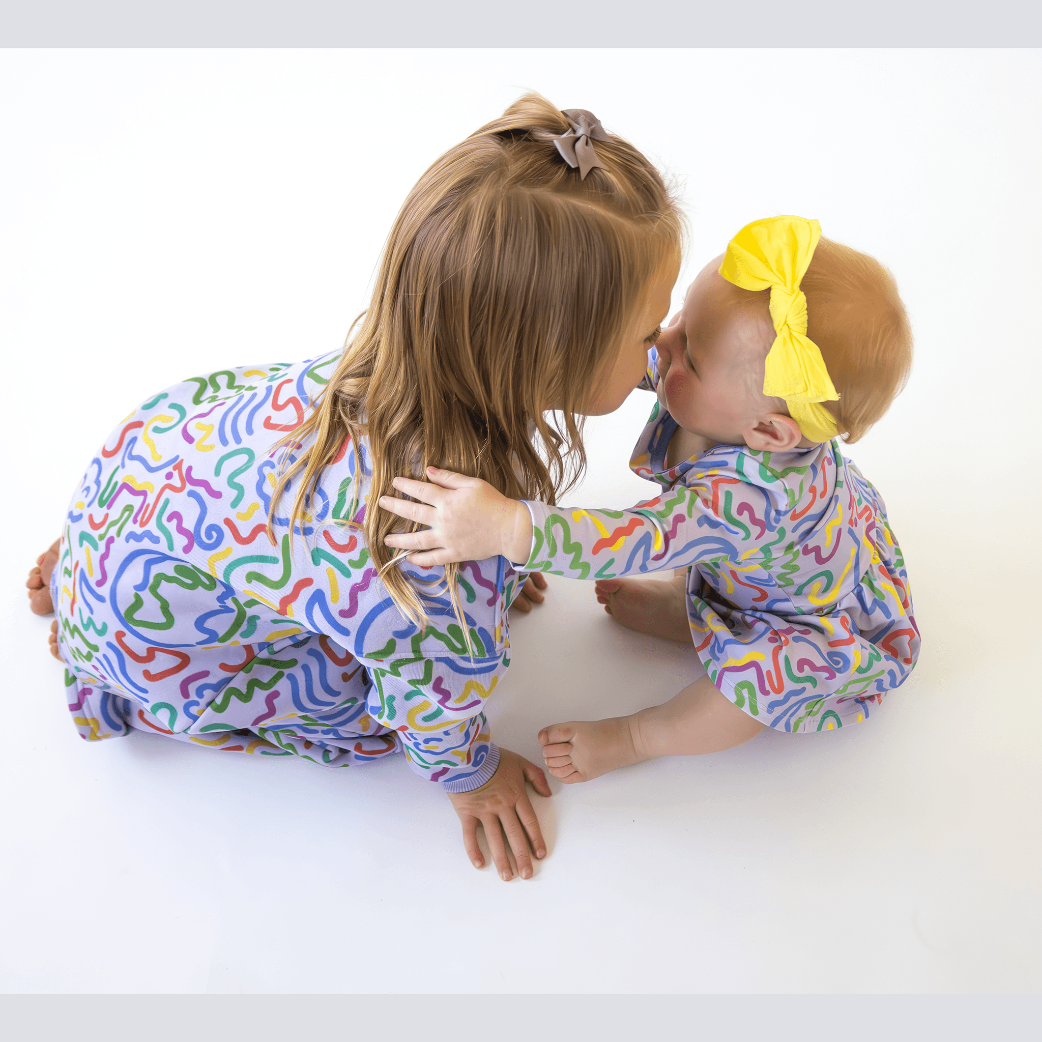 Anise & Ava's gender neutral exclusive hand drawn artwork eco friendly printed on a all cotton fleece. Made to match baby sibling's onesie. Perfect cozy pullover for the winter with a burst of color and inspiring art. 