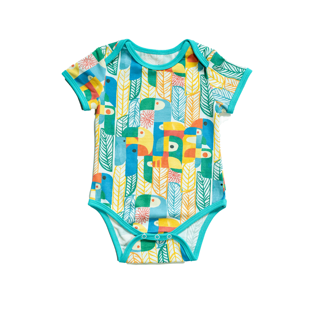 Anise & Ava's gender neutral colorful exclusive artwork designed and drawn in house. Baby snap body in Parrots print made to match siblings' styles in dresses & shirts for all boys & girls. 