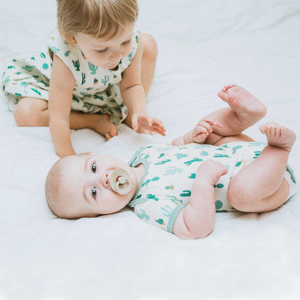 Cactus printed baby onesie, fun, colorful, gender neutral print to twin match with siblings and family by Anise & Ava.