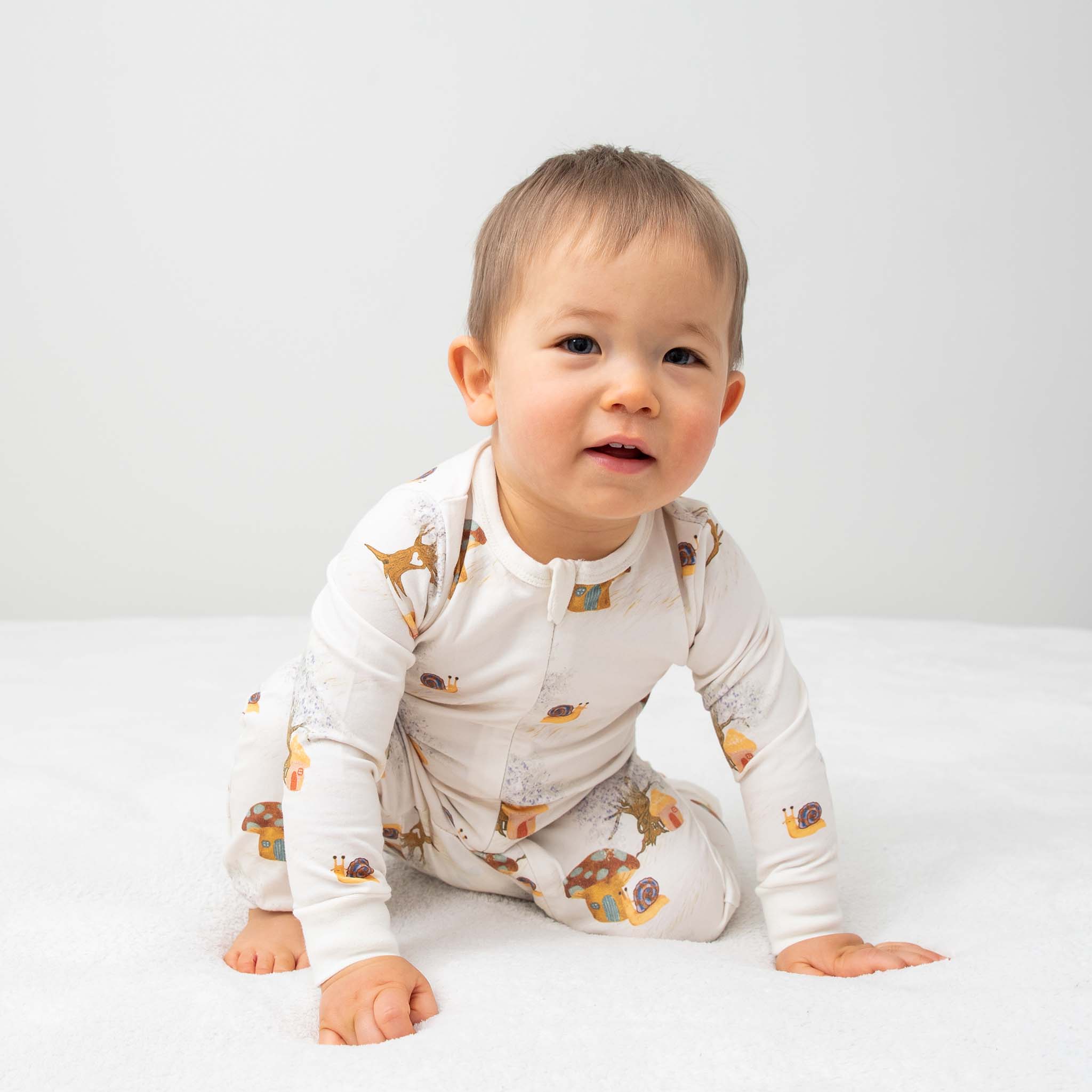 Anise & Ava's gender neutral  baby's zippy one piece  pajamas made with eco friendly hand drawn print in Magic Mushroom. Made with love and made to twin with siblings. 