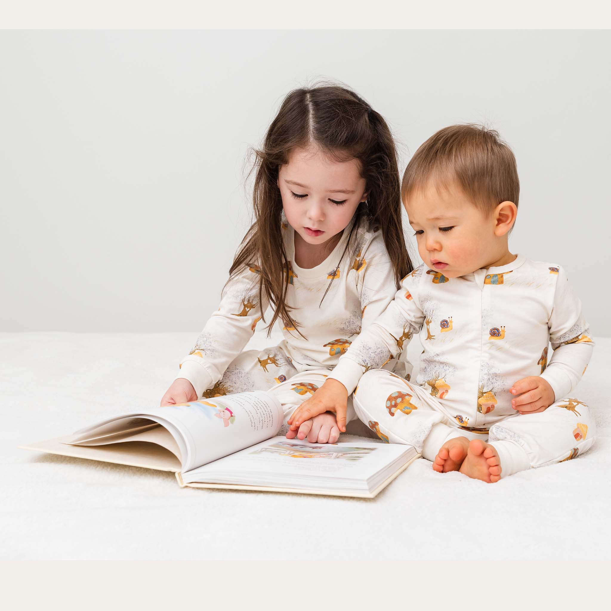 Anise & Ava's gender neutral  baby's zippy one piece  pajamas made with eco friendly hand drawn print in Magic Mushroom. Made with love , twinning with kids' 2 pieces pajamas in same print. 