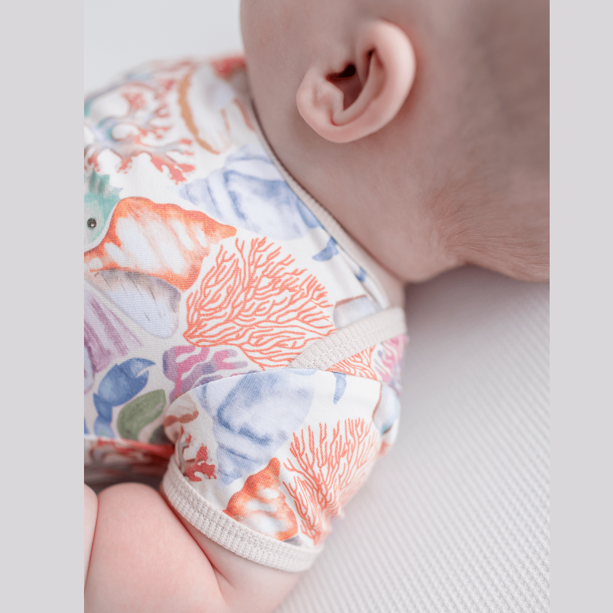 Anise & Ava handdrawn exclusive art, Ocean Puzzle, eco friendly printed on fine luxury cotton baby snap body.  Made with love to match siblings styles in tops and  dresses. 