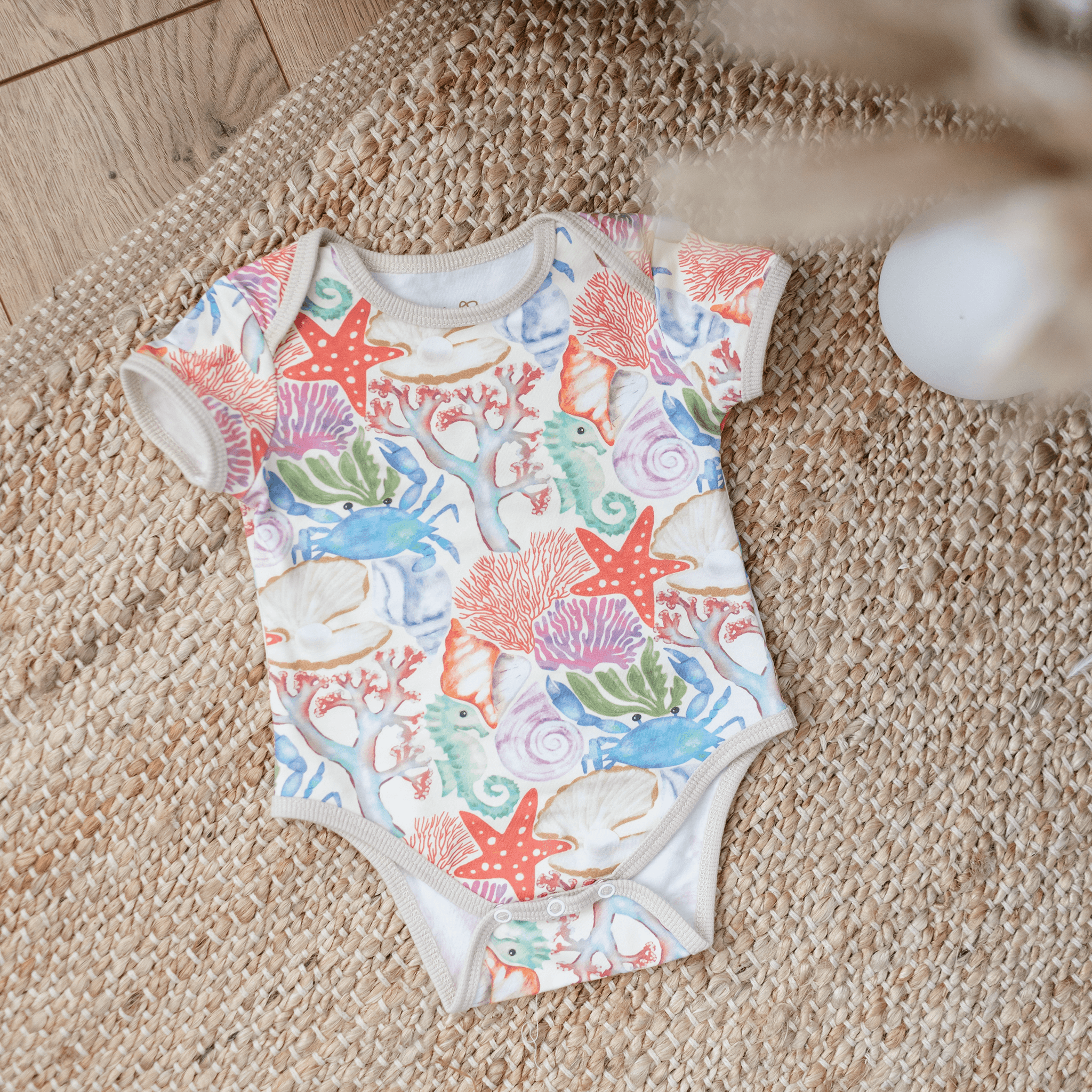 Anise & Ava handdrawn exclusive art, Ocean Puzzle, eco friendly printed on fine luxury cotton baby snap body.  Made with love to match siblings styles in tops and  dresses. 