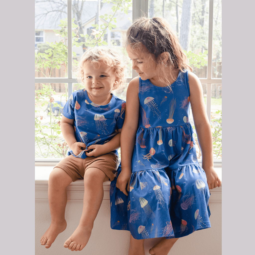 Anise & Ava genderless hand drawn exclusive art, eco friendly printed on luxury cotton. Anise & Ava sleeveless racer back dress, designed and made to match siblings' styles of baby onesies, dresses, tees, and shorts. 