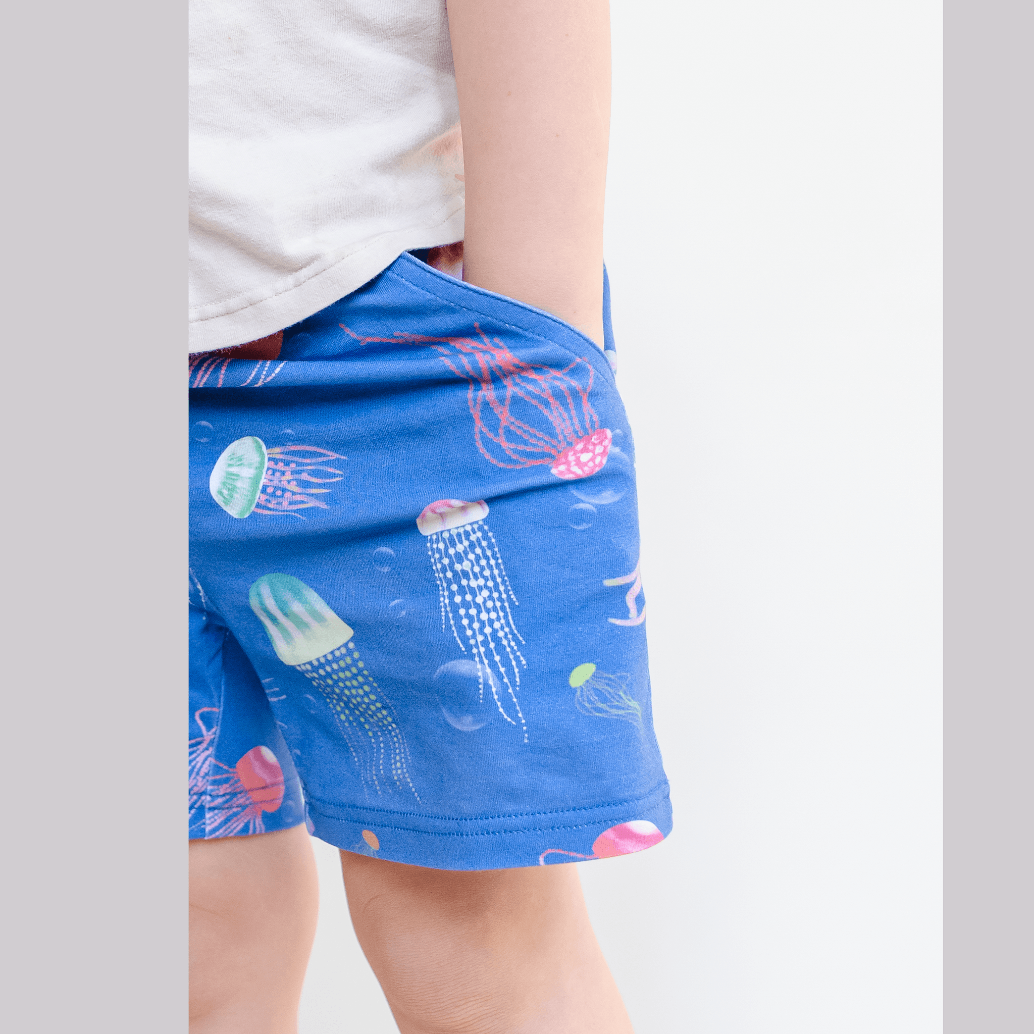 Anise & Ava genderless hand drawn exclusive art, eco friendly printed on luxury cotton. Printed jellysfish shorts are made with inseam fit for both boys & girls to tumble all day long. Can wear it alone or as a set. Made to match all siblings, baby onesie, romper, dresses and shorts. 
