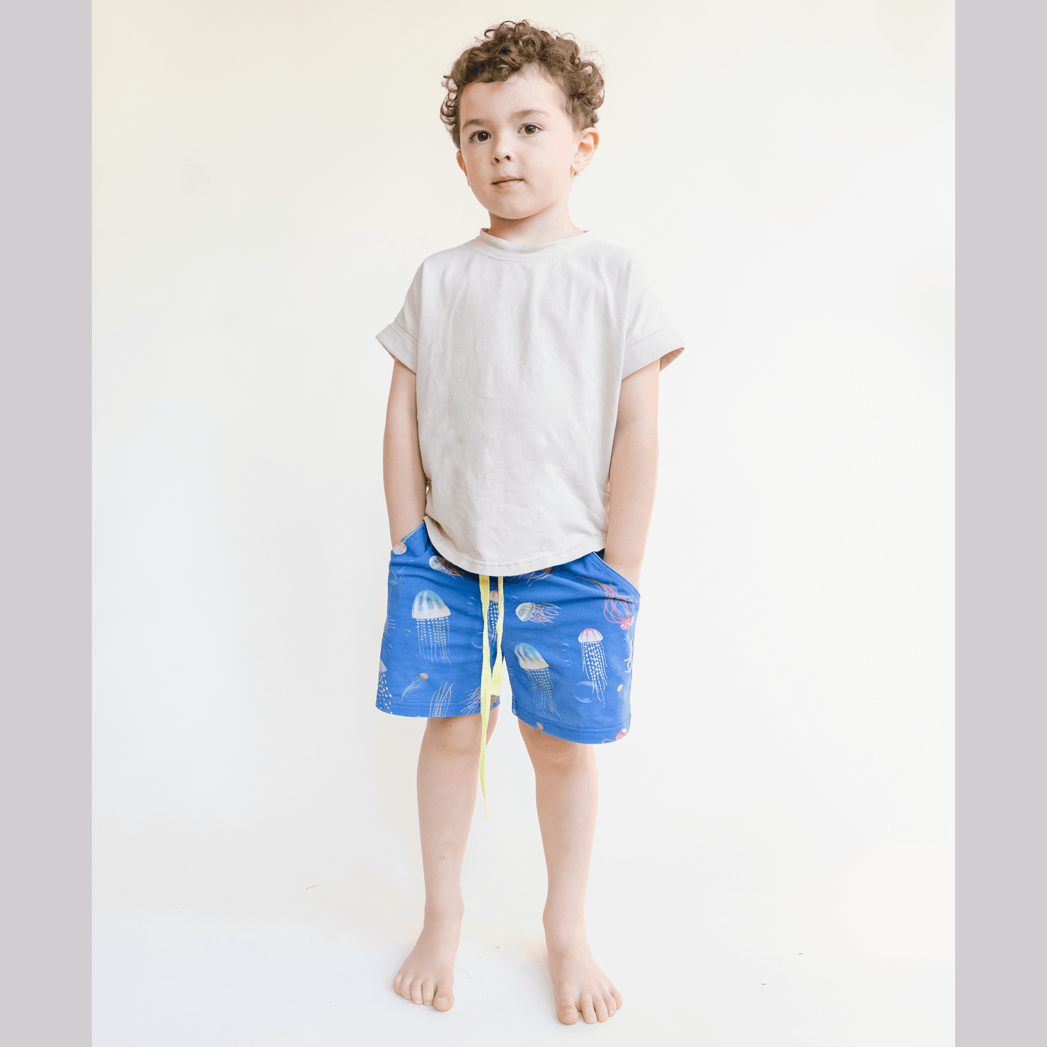 Anise & Ava genderless hand drawn exclusive art, eco friendly printed on luxury cotton. Printed jellysfish shorts are made with inseam fit for both boys & girls to tumble all day long. Can wear it alone or as a set. Made to match all siblings, baby onesie, romper, dresses and shorts. 