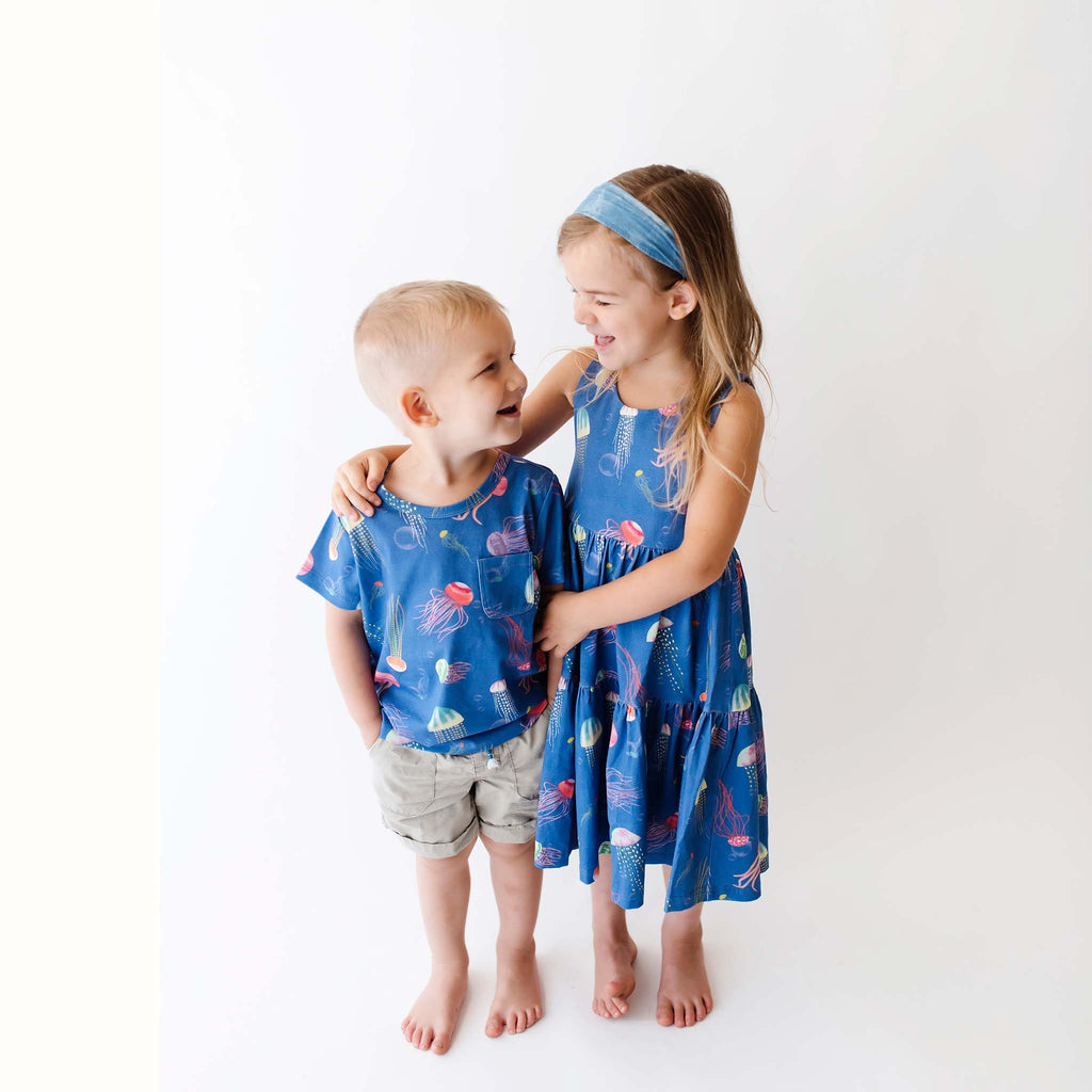 Anise & Ava genderless hand drawn exclusive art, eco friendly printed on luxury cotton. Anise & Ava sleeveless racer back dress, designed and made to match siblings' styles of baby onesies, dresses, tees, and shorts. 