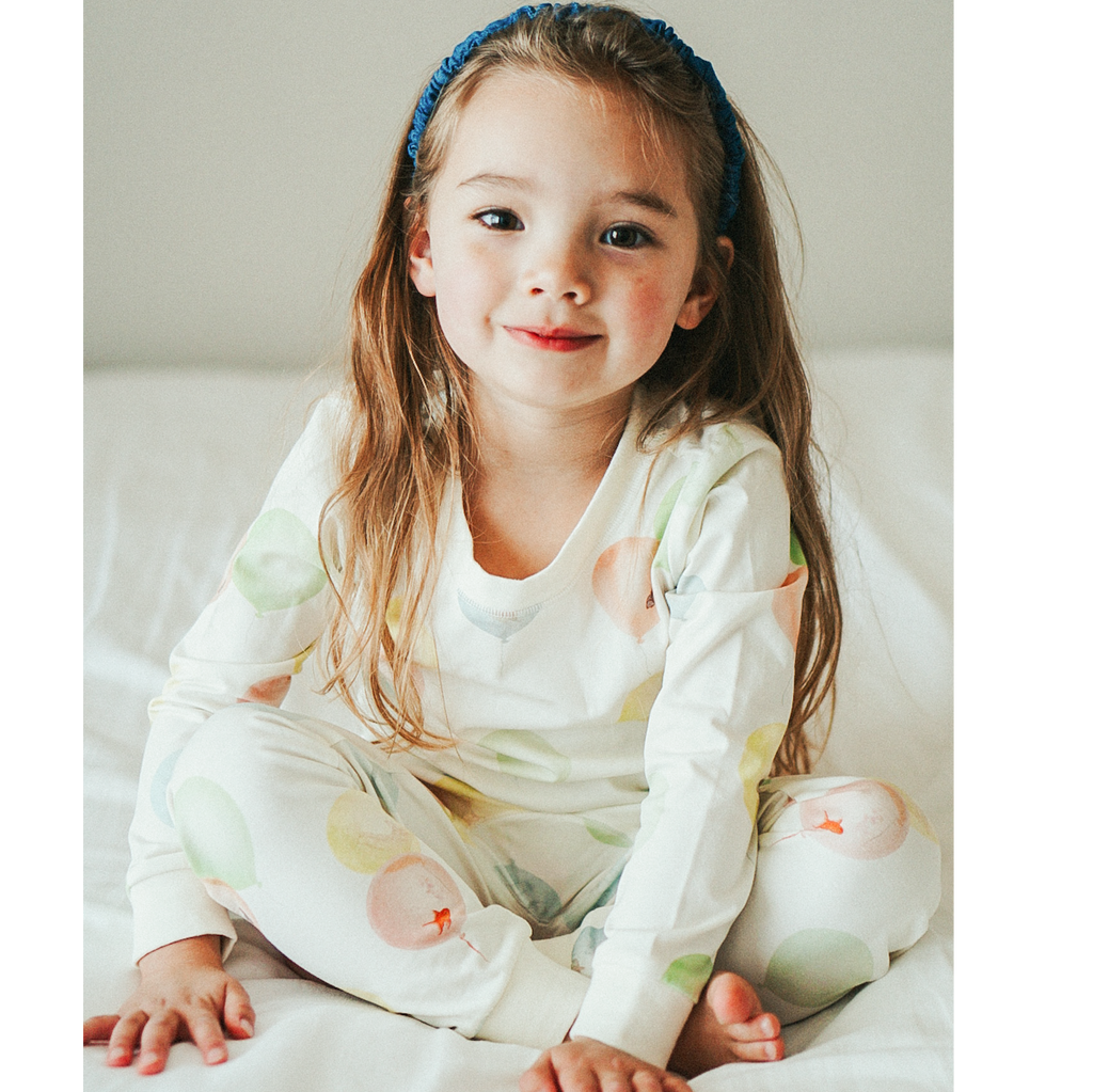 Anise & Ava genderless kids' pajamas in printed luxury cotton in Dreamy Bubbles. Made to match and twin with all siblings.