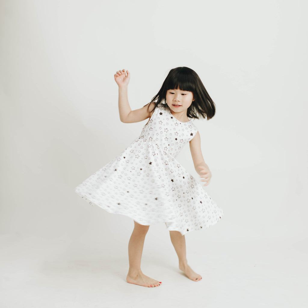 Girls' knit swirl dress in Starry print, to match with Mommy & me, daddy & me tees, and siblings' long johns and onesie dress.
