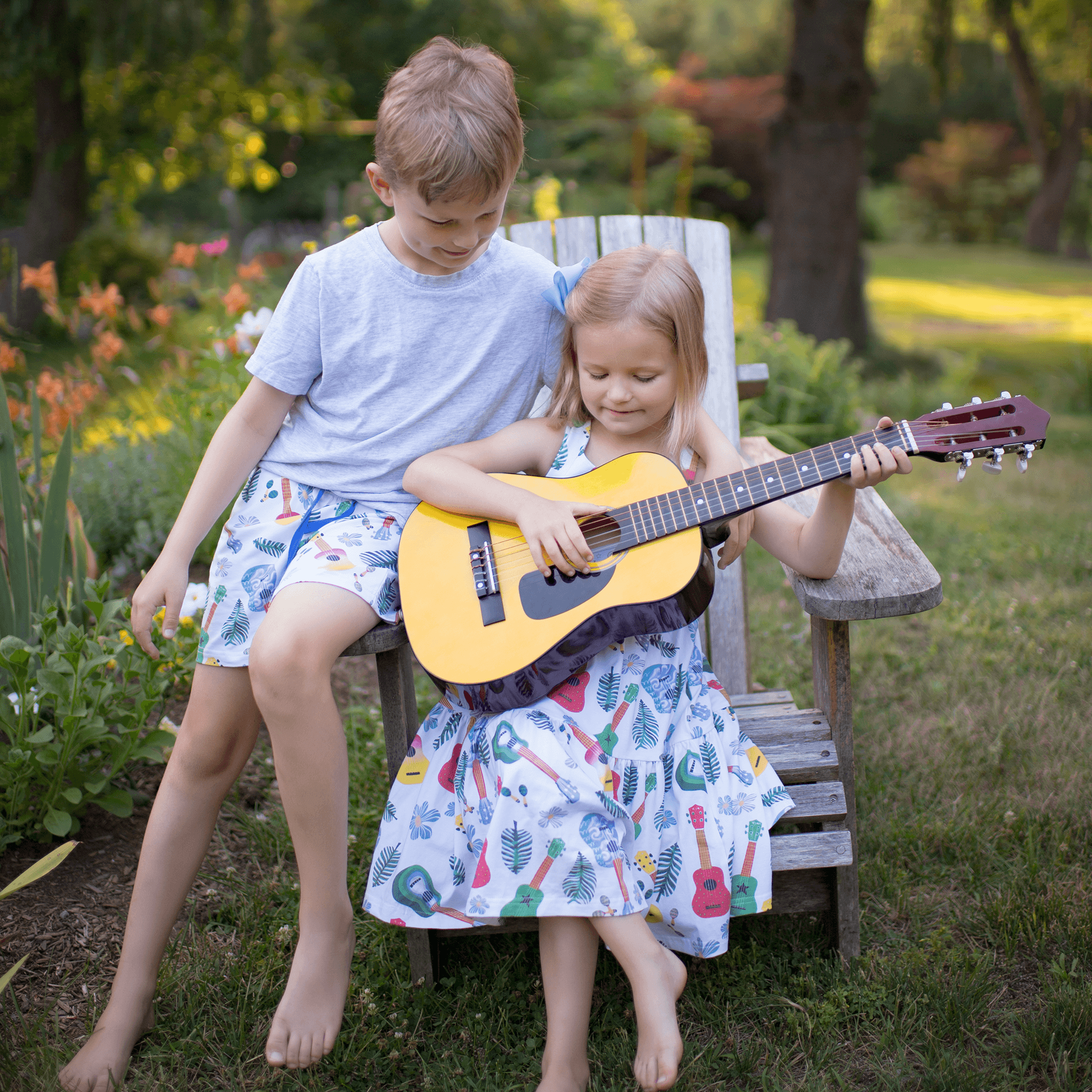 Anise & Ava genderless hand drawn exclusive art, eco friendly printed on luxury cotton. Anise & Ava sleeveless racer back dress, designed and made to match siblings' styles of baby onesies, dresses, tees, and shorts. 