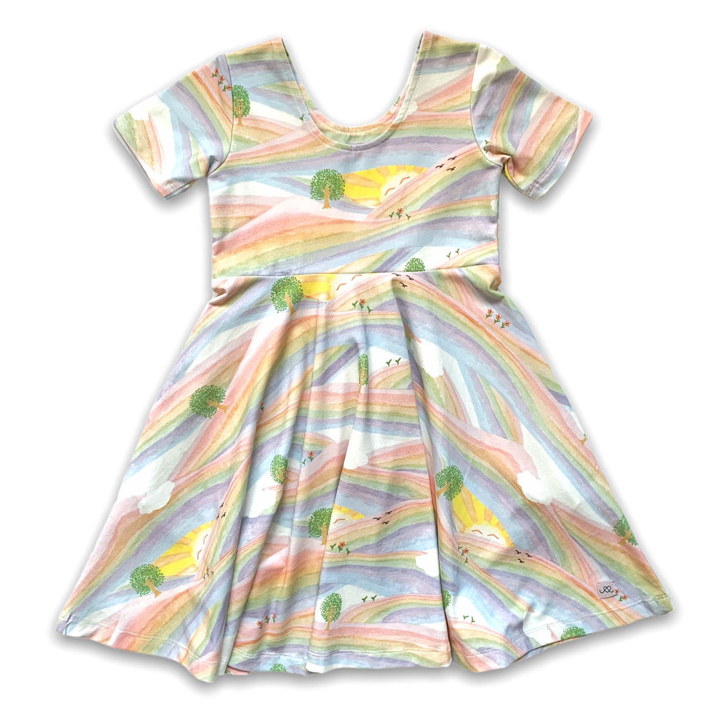 Anise & Ava genderless printed luxury cotton twirl dress with pockets Back in print Sunray Rainbow. Made to twin and match with other siblings.