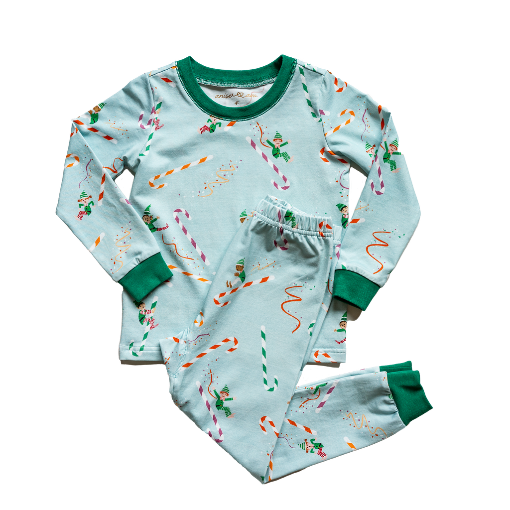 Anise & Ava 2 pcs holiday pajamas made to twin with baby's zip onsie. Created and drawn in house with an exclusive original genderless artwork you won't find anywhere else. Jam up with all the elvies of different skin color and ethnicities sliding down  candy cane slides!!!