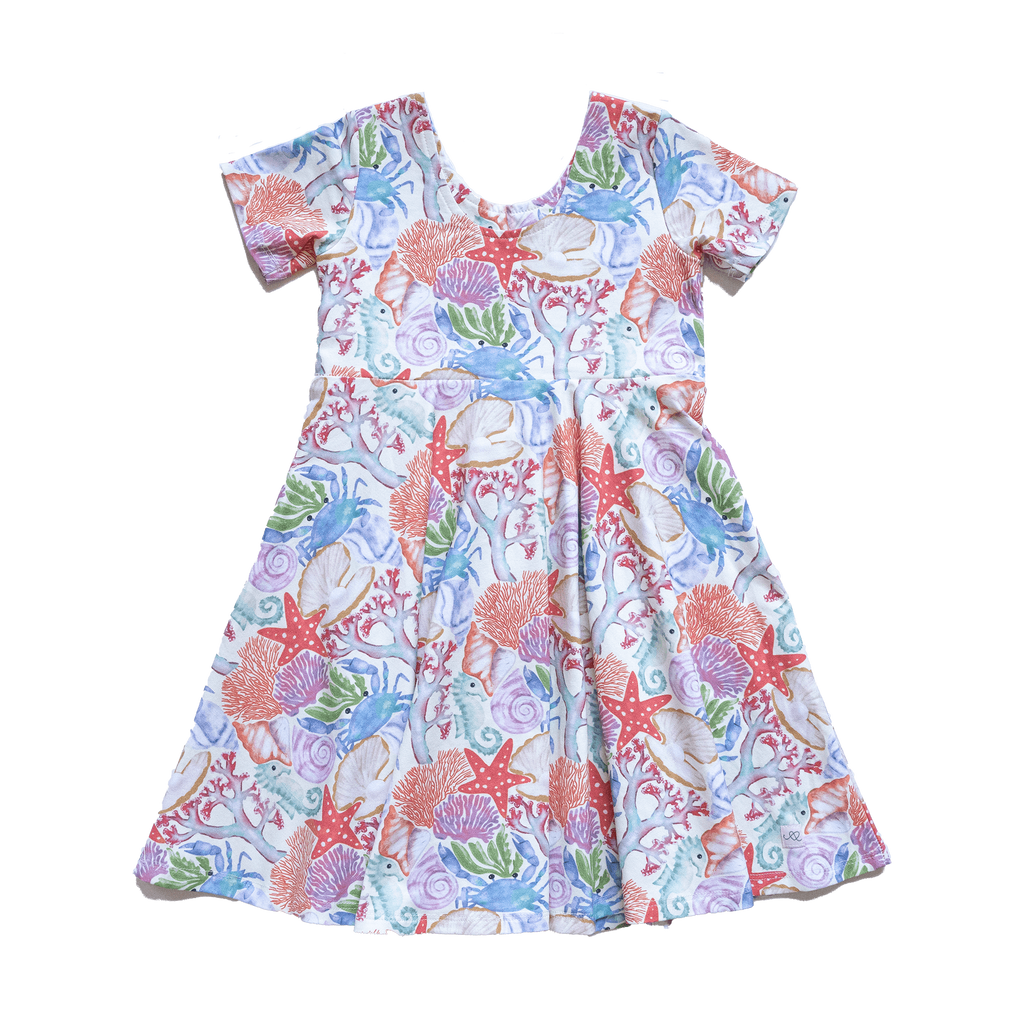Anise & Ava genderless hand drawn exclusive artwork, eco friendly printed on luxury cotton. Anise & Ava short sleeves pocketed twirl full circle dress, designed to match with siblings' styles, baby onesies, body, and kids' tee and shorts. 