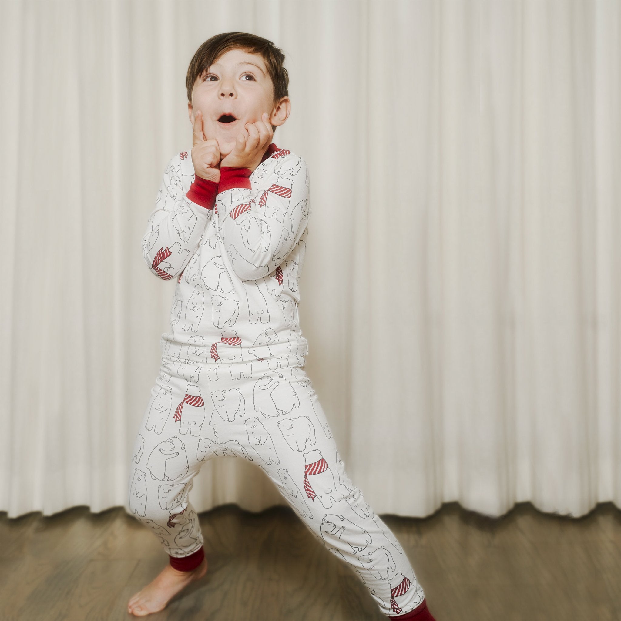 Kids' PJ sets in holiday Cozy Bear print for Mommy & Me, Daddy& Me, and siblings twinning for the perfect holiday family photo. 