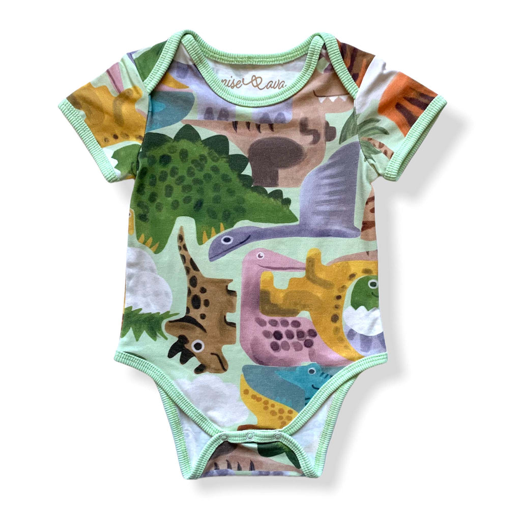 Anise & Ava genderless baby onesie body front in Dino Puzzle print with ribbing and envelop neck for easy wearing. 