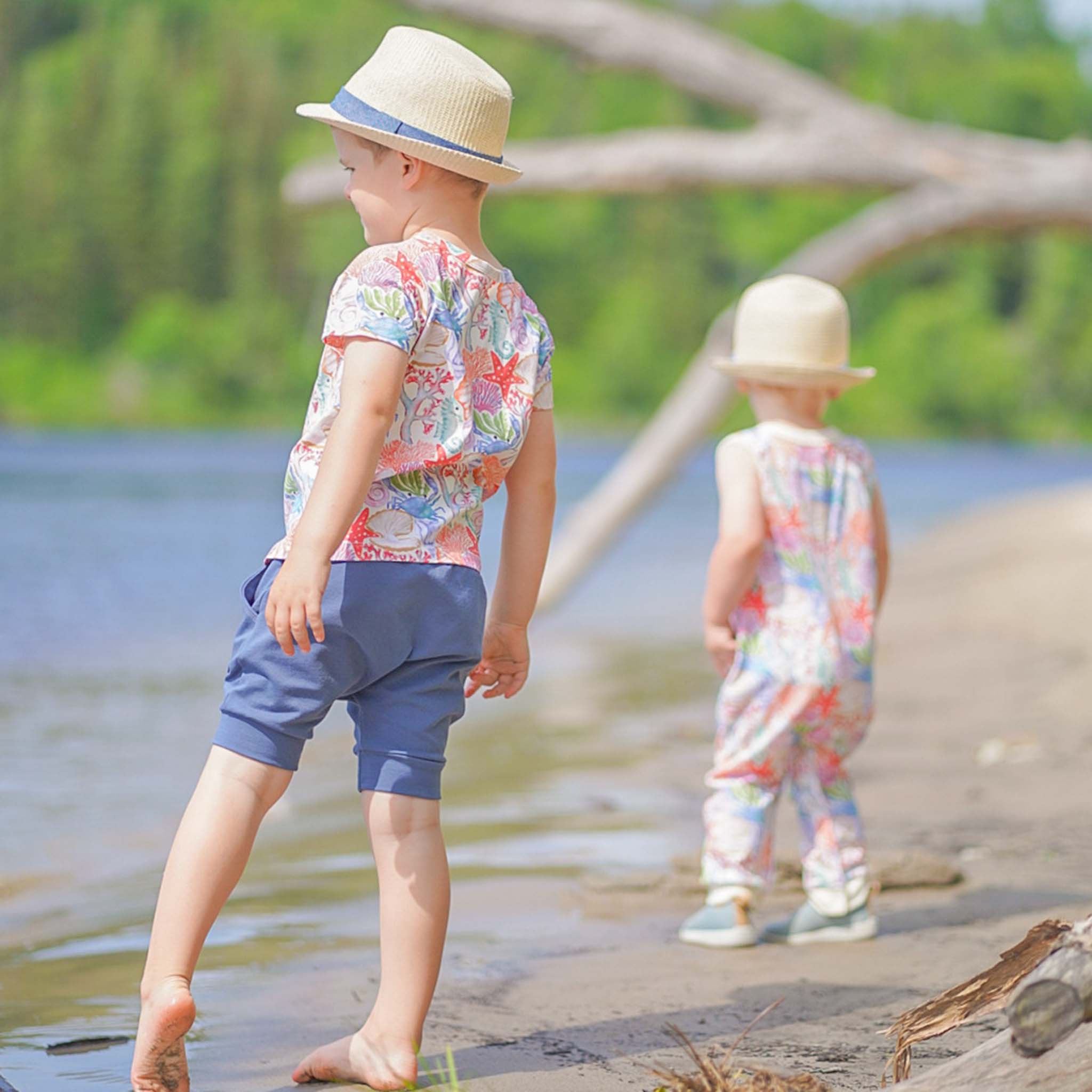 Anise & Ava genderless hand drawn exclusive art, Ocean Puzzle, printed on luxury cotton. Baby romper is perfect for Summer. Made with love and to match with siblings in same ocean puzzle print in tee or dress. 