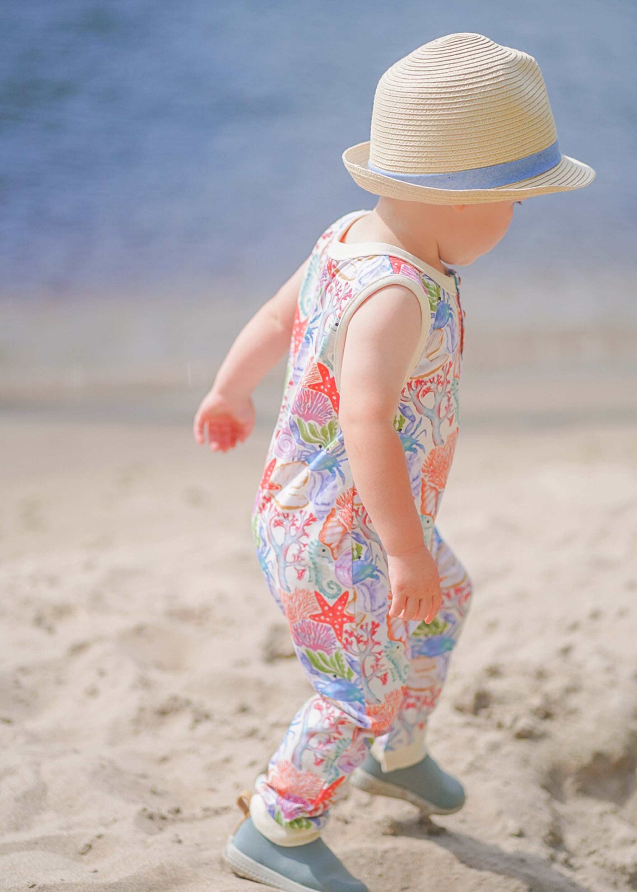 Anise & Ava genderless hand drawn exclusive art, Ocean Puzzle, printed on luxury cotton. Baby romper is perfect for Summer. Made with love and to match with siblings in same ocean puzzle print in tee or dress. 