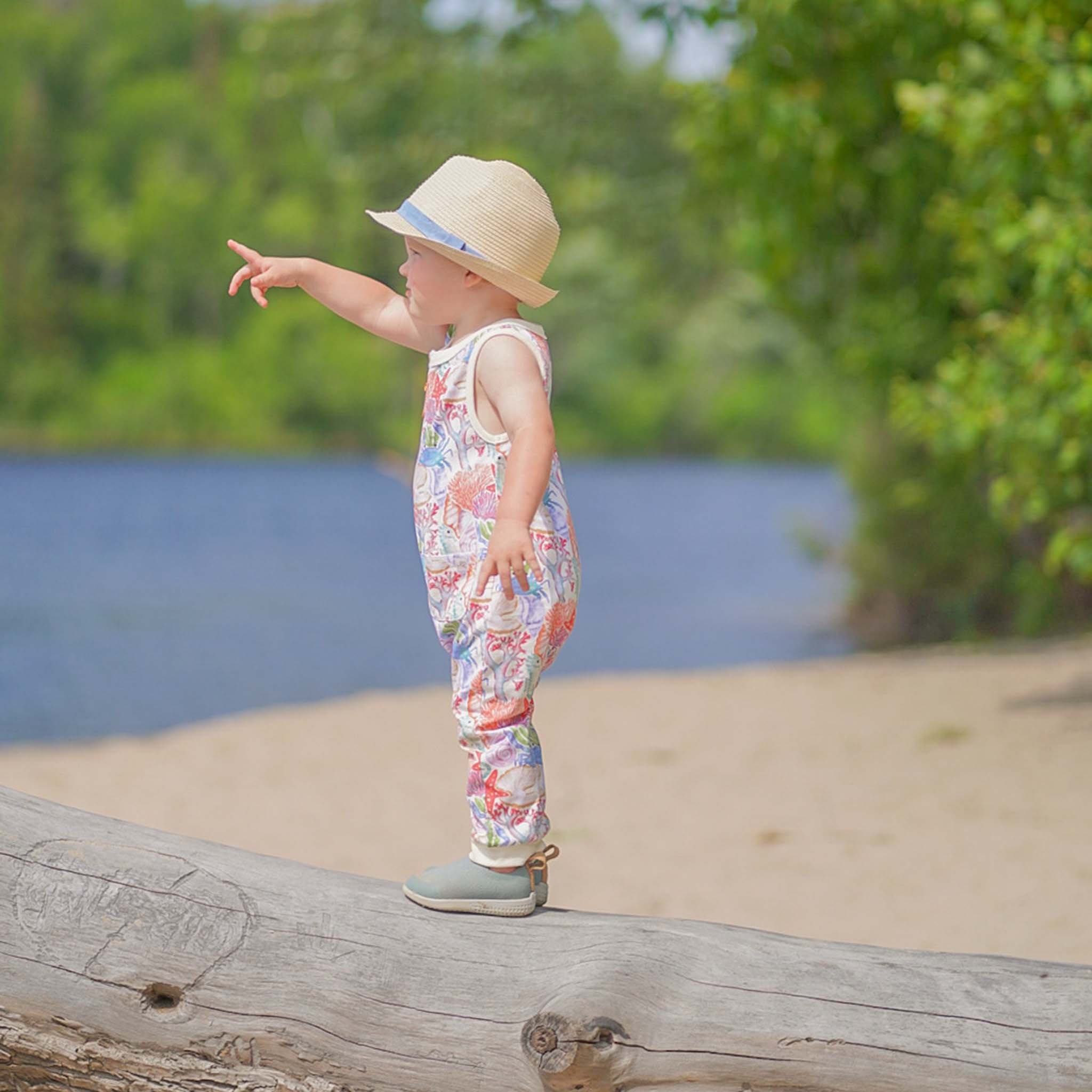 Anise & Ava genderless hand drawn exclusive art, Ocean Puzzle, printed on luxury cotton. Baby romper is perfect for Summer. Made with love and to match with siblings in same ocean puzzle print in tee or dress. 